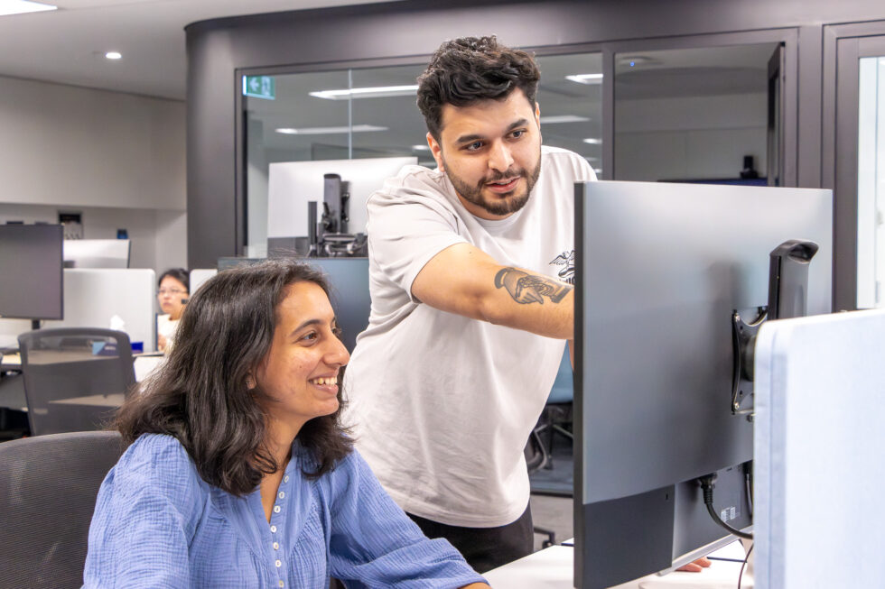 Anubhab Karki Software Engineer working with his team at his desk